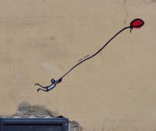 man holding balloon painting